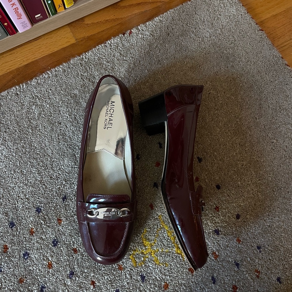 Burgundy heeled loafers by Michael Kors
